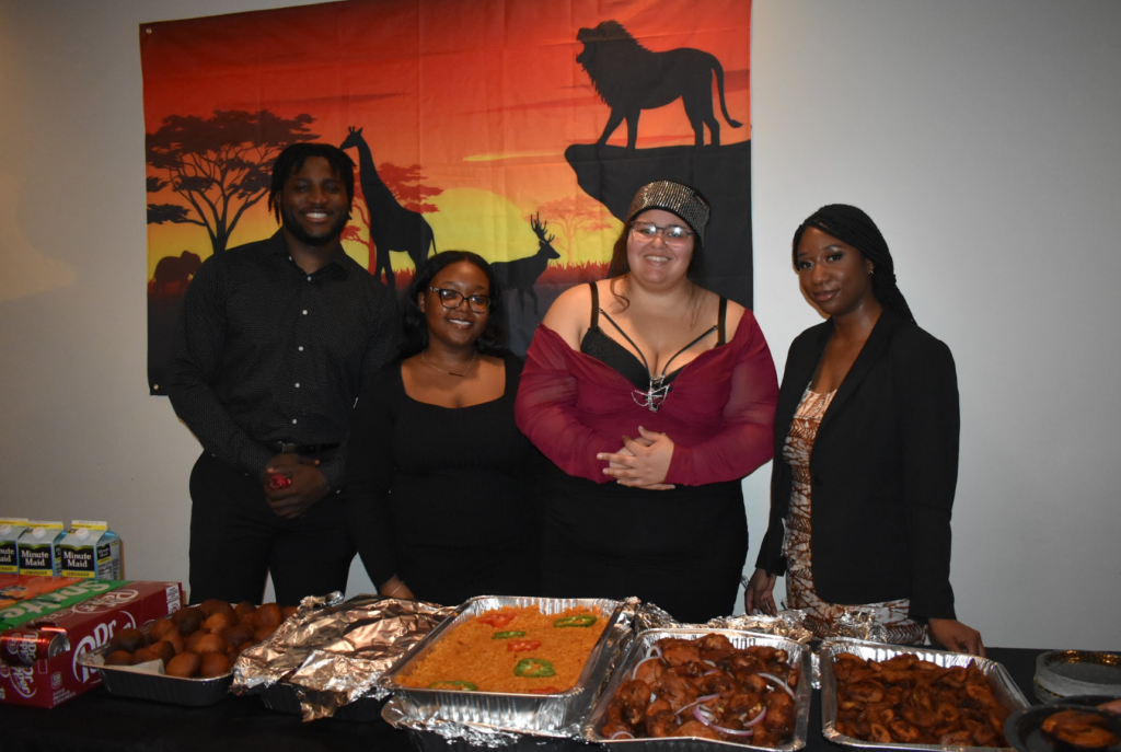 Abraham Ohiokhai-Benson, Daicya Dawson, Niera Crawford and
Zeina Ly, RASA E-board serves guests African cuisine.