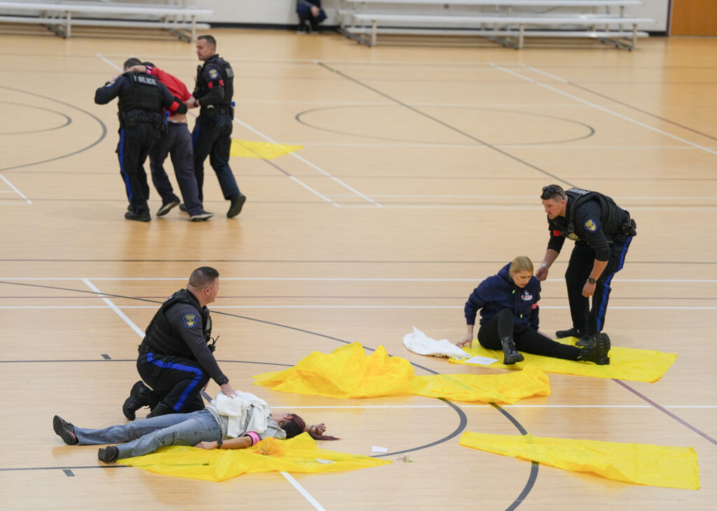 First responders demonstrate life-saving techniques on the SRC basketball courts.