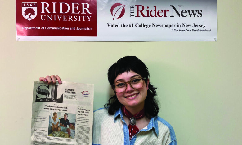 Amethyst Martinez, junior journalism major, poses with her front page byline in The Star-Ledger.