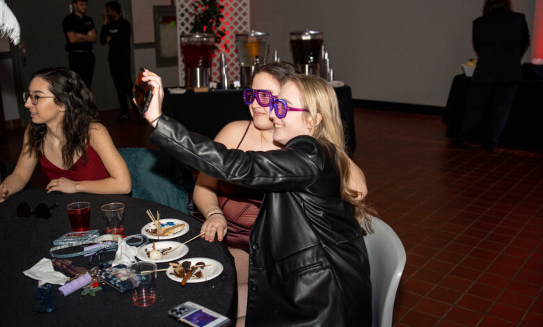 Kayla Faynor (front) a sophomore psychology major, poses for a selfie with alumni Kayla Plunto (back).