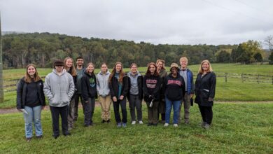 The students in Environmental Field Methods and Data Analysis along with professors stand on James Madison's Montpelier Plantation.