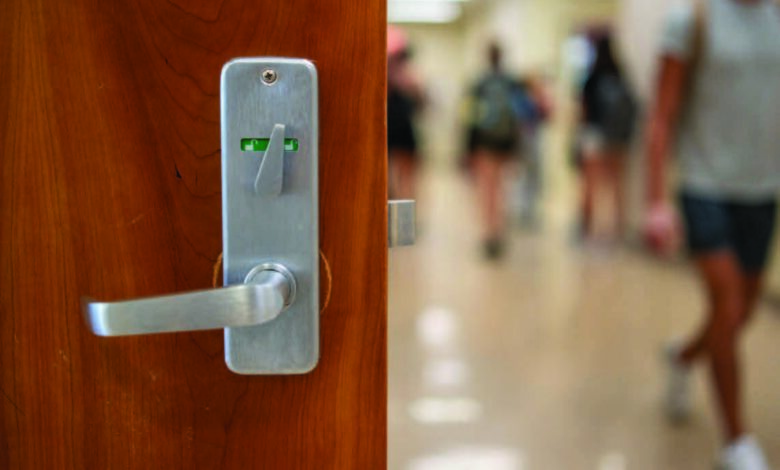 Locks are installed on doors in Lynch Adler Hall to increase classroom safety.