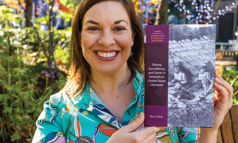 Author and professor Kelly Ross poses with her book.