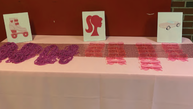 Barbie themed accessories are displayed for viewers upon entrance to the event.
