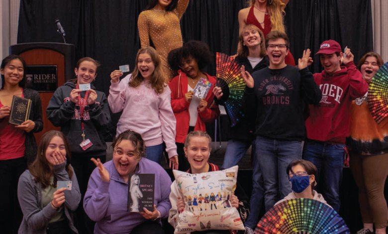 Students pose with their prizes and the returning drag queens.