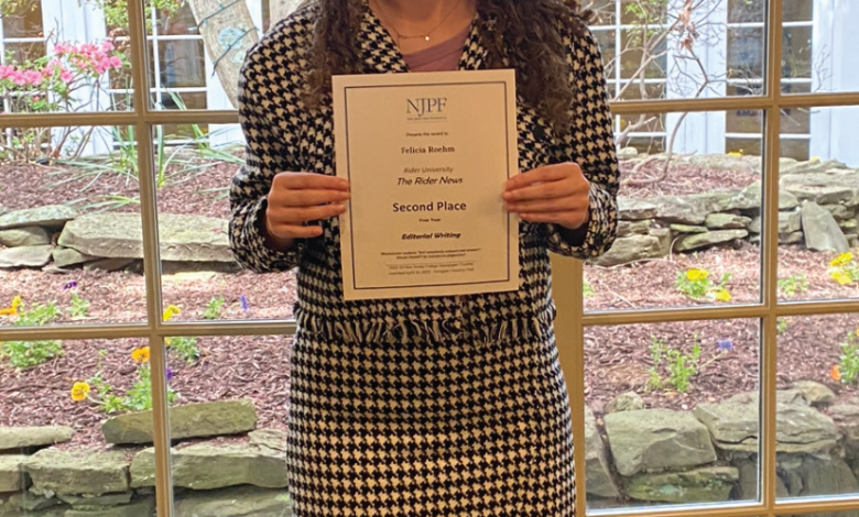 Felicia Roehm posing with her New Jersey Press Foundation award.