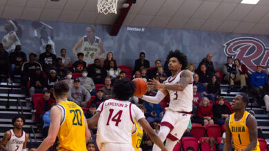 Senior guard Corey McKeithan drives in for a layup to add on to Rider’s big lead. Photo by Maggie Kleiner