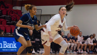 Graduate student guard Taylor Langan moves past the defender. Photo by Maggie Kleiner