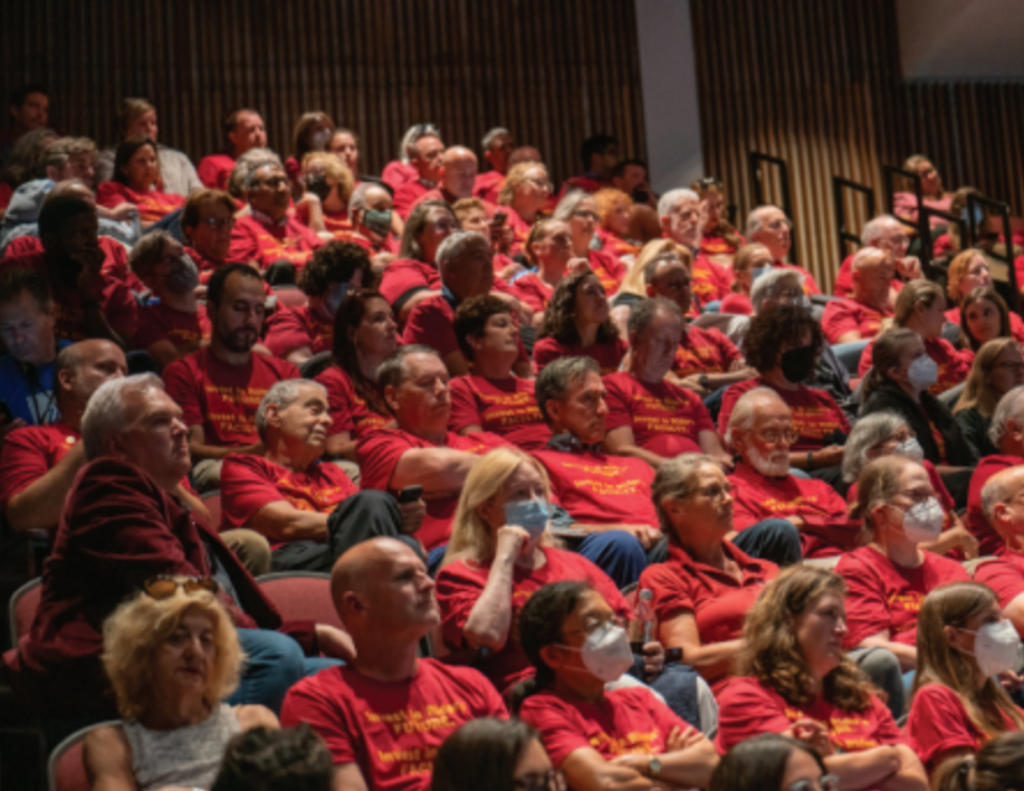 Members of the AAUP sit together in matching cranberry shirts during the Sept. 1 faculty and staff convocation.