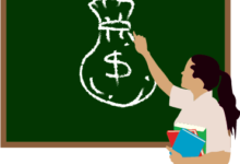 A teacher points to a chalk board with money drawn on it.