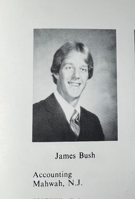 Man smiling in a yearbook photo. 