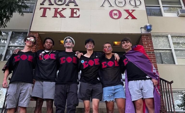 Members of Sigma Phi Epsilon stand in front of University House, where on-campus fraternities currently live.