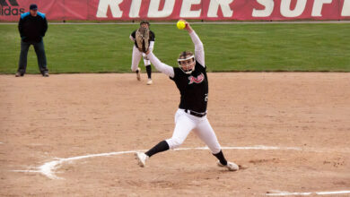 Sophomore pitcher Fallyn Stoeckel fires one in the box. Photo by Maggie Kleiner/The Rider News