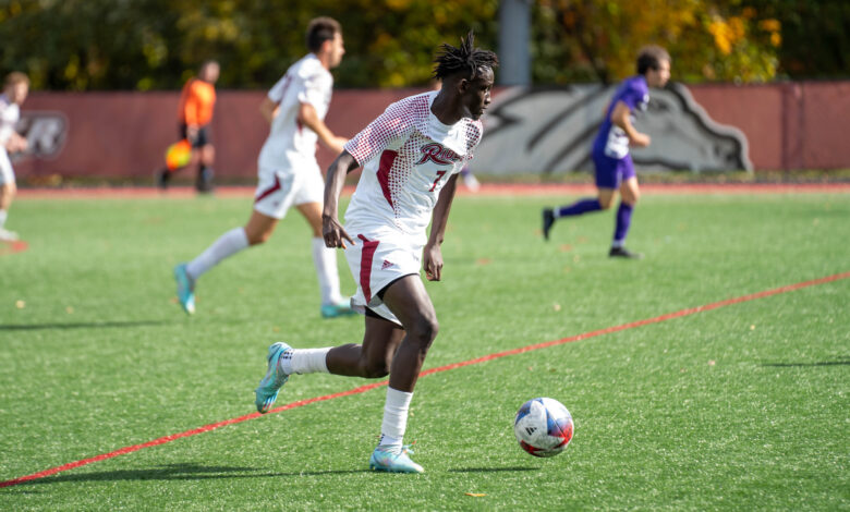 Junior midfielder Momo Diop travels with the ball.