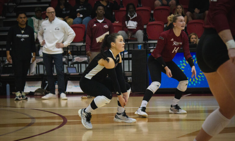 Junior libero Keegan O'Connor gets ready to receive the ball.