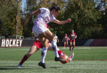 Senior midfielder Amanda Mendez rises high to fire the ball down the field. Photo by Destiny Pagan/The Rider News