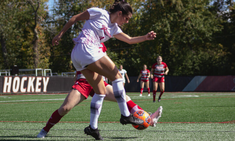 Senior midfielder Amanda Mendez rises high to fire the ball down the field. Photo by Destiny Pagan/The Rider News