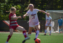 Freshman midfielder Ava DeGeorge takes the ball from the defender.