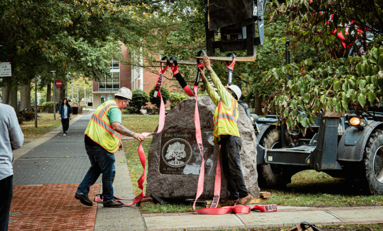 Contractors place the Rider Rock into the ground in its new home.