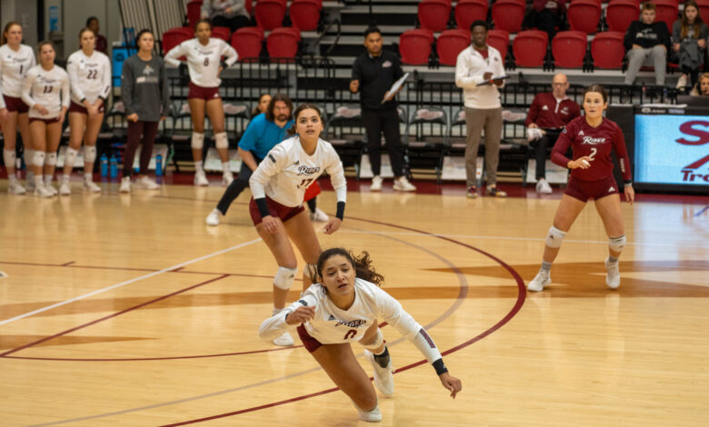 Sophomore libero Simone Langford looks on as senior setter Ryley Frye dives for the ball. Photo by Kaitlyn D'Alessio