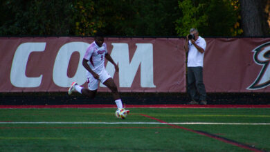 Senior midfielder Bryan Okongo dribbles the ball up the field. Photo by Destiny Pagan