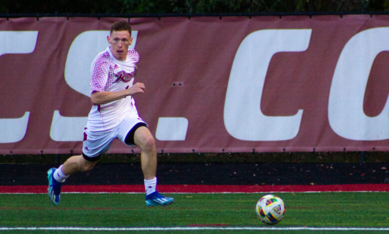 Senior midfielder Jack McGeechan travels with the ball. Photo by Destiny Pagan.