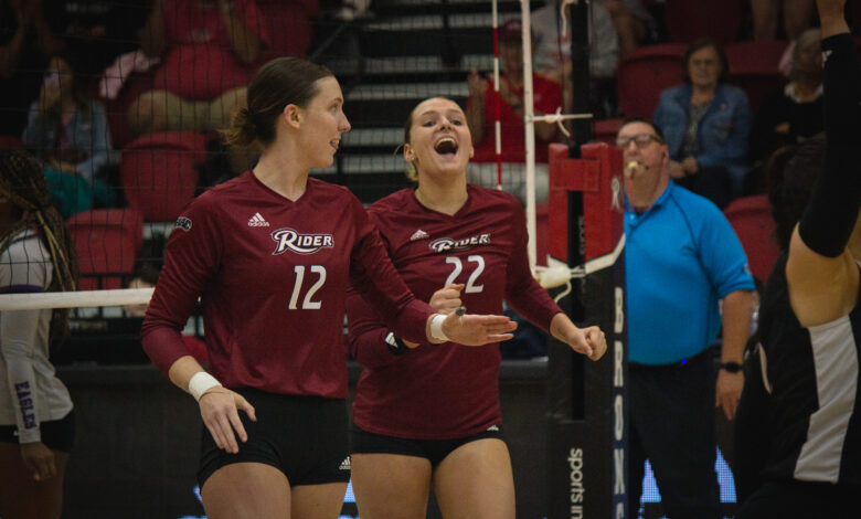 Junior middle hitter Carley McAleavey and sophomore opposite Anja Kelly celebrate after a score. Photo by Destiny Pagan/The Rider News.