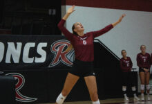 Sophomore middle hitter Molly Rohde serves the ball. Photo by Destiny Pagan/The Rider News.