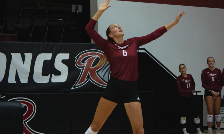 Sophomore middle hitter Molly Rohde serves the ball. Photo by Destiny Pagan/The Rider News.