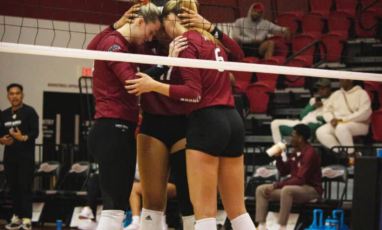 The Broncs huddle up before their next set. Photo by Destiny Pagan.