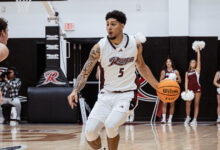 Senior forward Jay Alvarez collects his dribble. Photo by Josiah Thomas