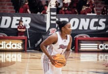 Freshman guard Camryn Collins draws up a play. Photo by Josiah Thomas.