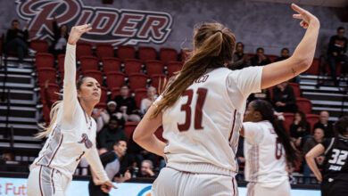 Junior forward Emilee Tahata and senior guard Gabby Turco celebrate a made bucket. Photo by Josiah Thomas/The Rider News.