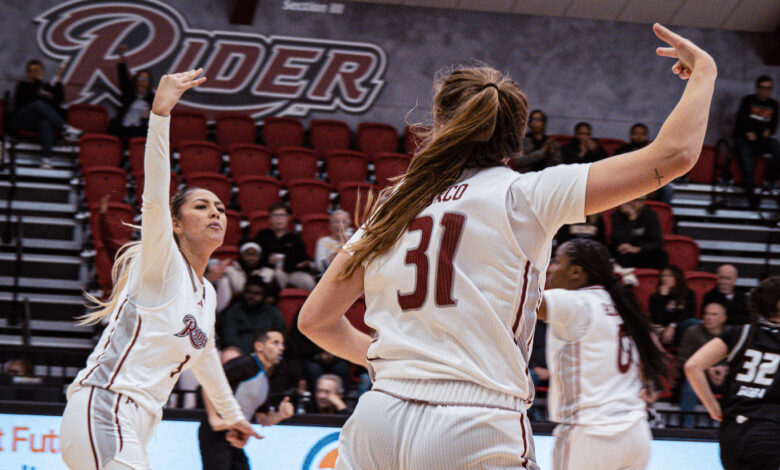 Junior forward Emilee Tahata and senior guard Gabby Turco celebrate a made bucket. Photo by Josiah Thomas/The Rider News.