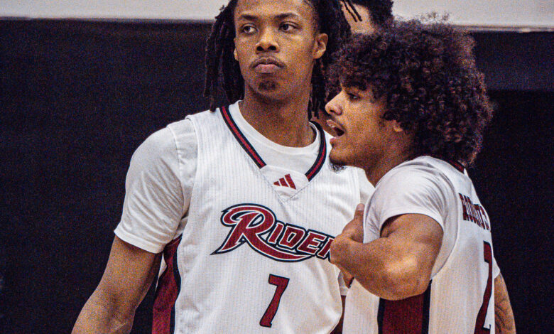 Sophomore guard Ife West-Ingram Jr (left) and sophomore guard Ruben Rodriguez (right) discuss a play on the court. Photo by Josiah Thomas/The Rider News