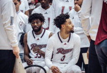 Graduate student guard T.J. Weeks Jr (left) sits on the bench along side junior guard Zion Cruz (right). Photo by Josiah Thomas/The Rider News