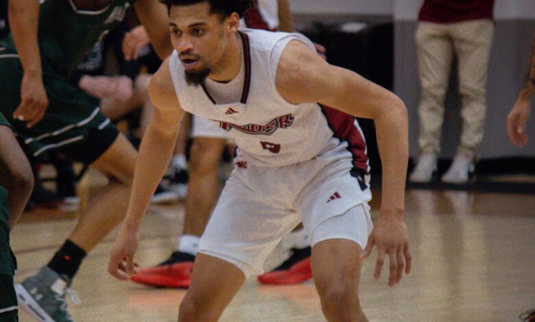 Junior guard Zion Cruz gets down in his defensive stance. Photo by Destiny Pagan/The Rider News