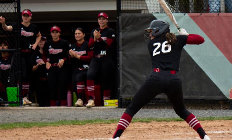 Junior outfielder Maddie Luedtke winds up for an incoming pitch. Destiny Pagan/The Rider News.