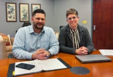 Ryan McKinney and Debbie Stasolla smile at the camera.