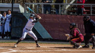 Junior pitcher Fallyn Stoeckel winds up for the incoming pitch. Destiny Pagan/The Rider News.