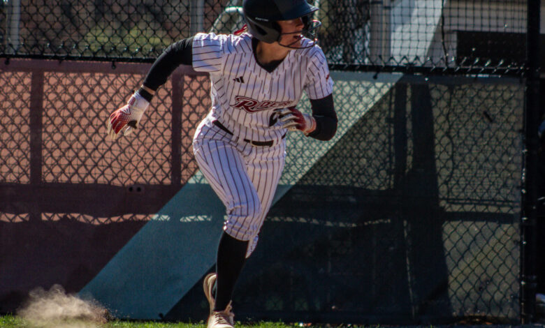 Sophomore infielder Kierten Buchanon races to first after a hit. Photo by Destiny Pagan
