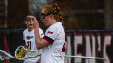 Graduate student attacker Anna Devlin scouts out the defense. Photo by Destiny Pagan/TheRiderNews