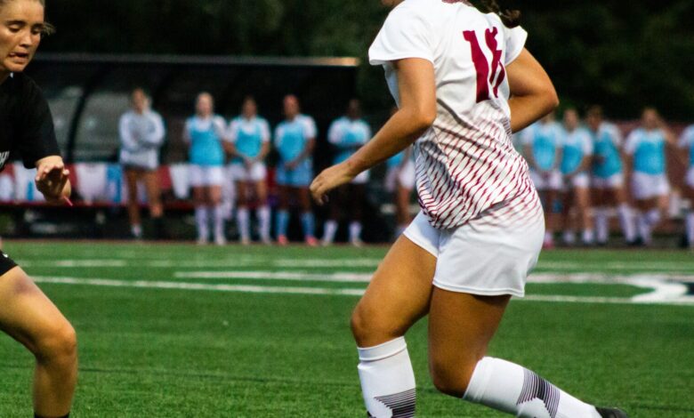 Junior forward Ava Ferrie makes a move around an attacker. Photo by Destiny Pagan