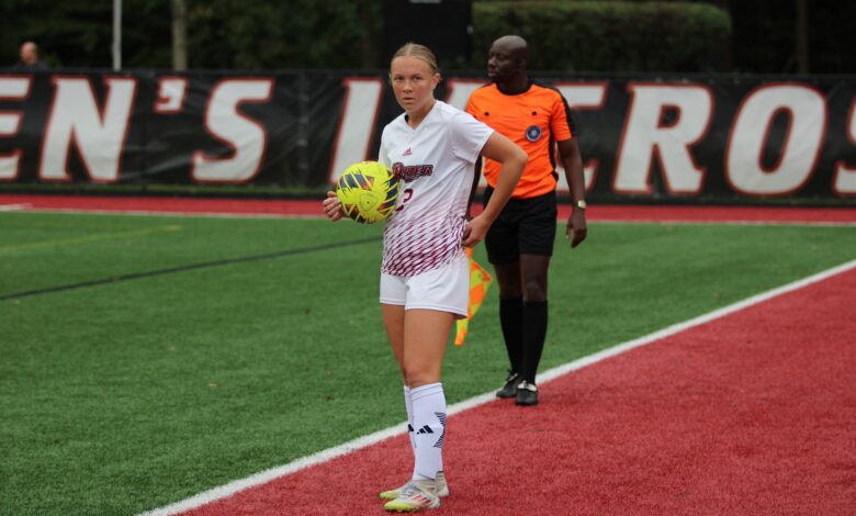 Freshman back Ella Baumgardt defends the ball on the sidelines of Ben Cohen Field. Photo by Liliana R. Basile.