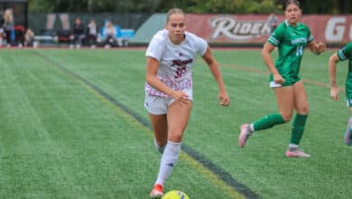 Junior forward Noa Menzing moves the ball down the turf at Ben Cohen Field. Photo by Liliana R. Basile/The Rider News