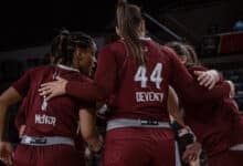 Junior guard Aliya McIver (left) huddles with junior center Kaylan Deveney. Photo by Josiah Thomas/The Rider News