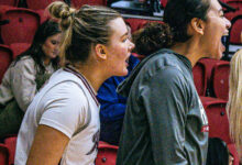 Junior guard Emmy Roach (left) and junior forward Sam Richardson celebrate a basket made by the Broncs. Photo by Josiah Thomas/The Rider News