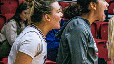 Junior guard Emmy Roach (left) and junior forward Sam Richardson celebrate a basket made by the Broncs. Photo by Josiah Thomas/The Rider News