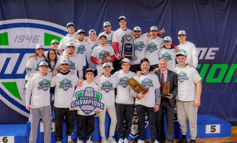 The 2025-26 Rider wrestling roster poses for a picture with the MAC trophy. Photo courtesy of Jack Verdeur