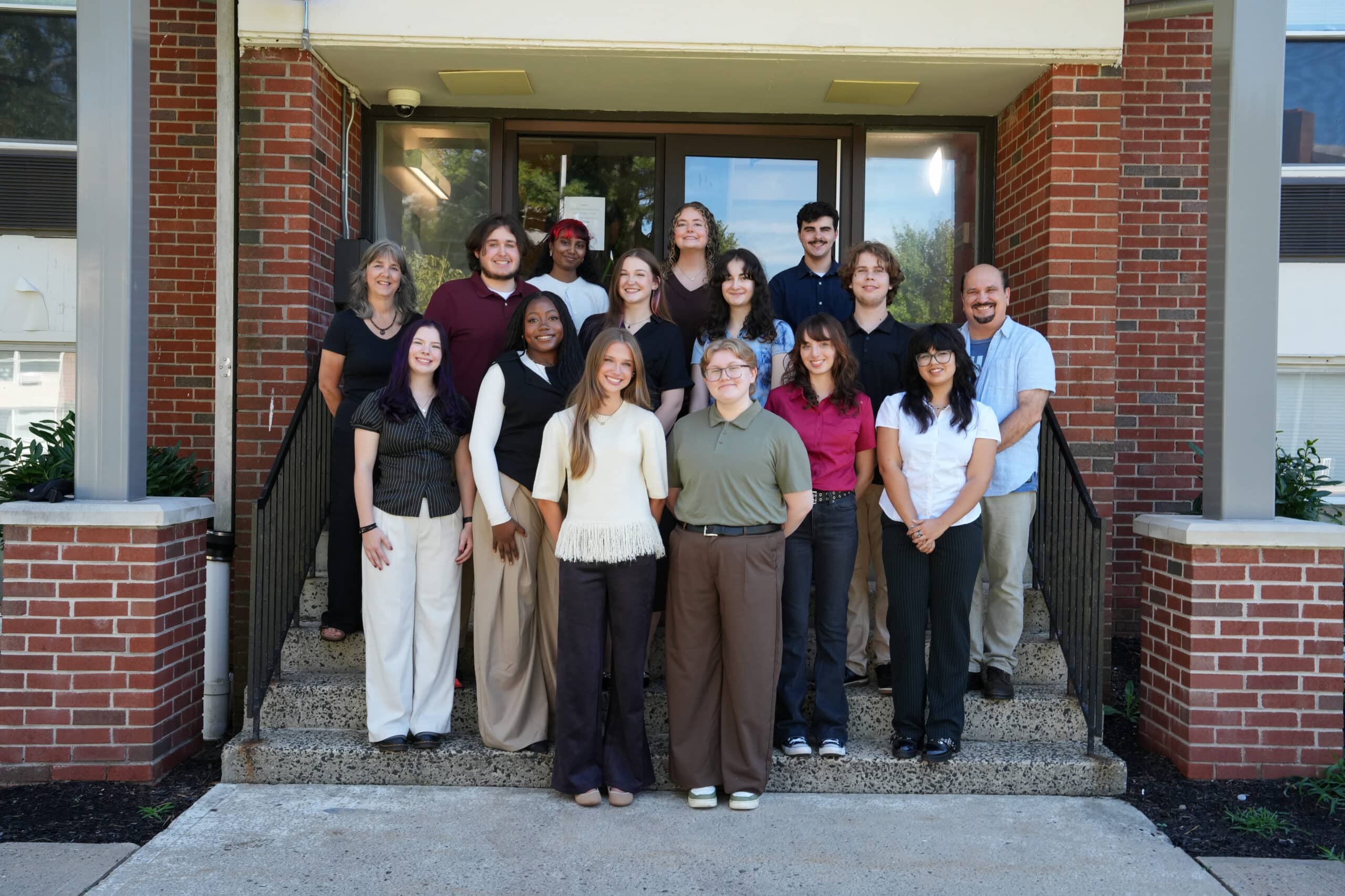 The Rider News staff posed outside of Longstreet House. Front row: Samantha Clark, Cal Sutton. Second row: Abby Ray, Tatyanna Beauliere-Jackson, Mallory Hoelzl, Grace Juarez. Third row: Barbara Boyer, Joshua Yuhas, Brannagh Rattigan, Sofia Santiago, Alfie Eville, John Mozes. Back row: Jenna Munswami, Teagan Rotella, Matthew Cirola.